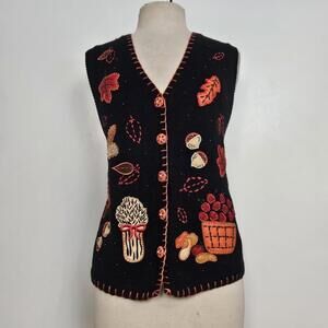 Black autumn fall sweater vest with embroidered and beaded details.